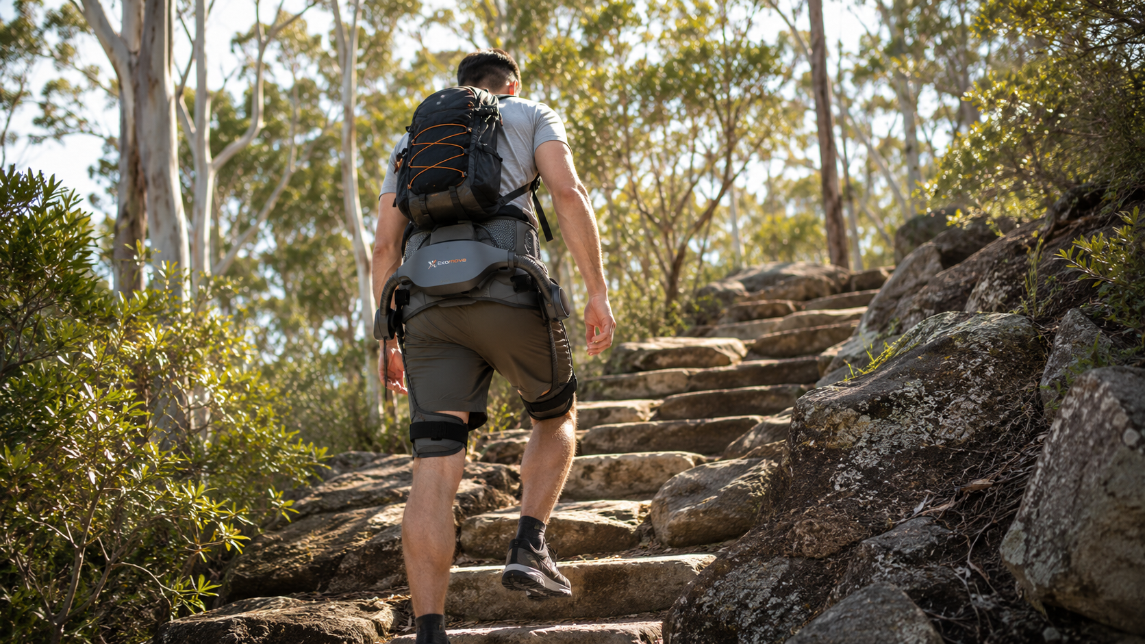 Hiker wearing Exomove Stride while climbing stone steps